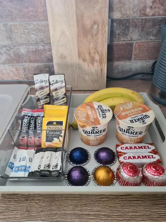 a tray of food with muffinsaminesaminesaminesaminesktop at The Hide in Ullapool