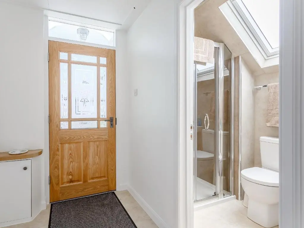 a bathroom with a toilet and a sink at Willow Cottage - Uk39244 in Inverness
