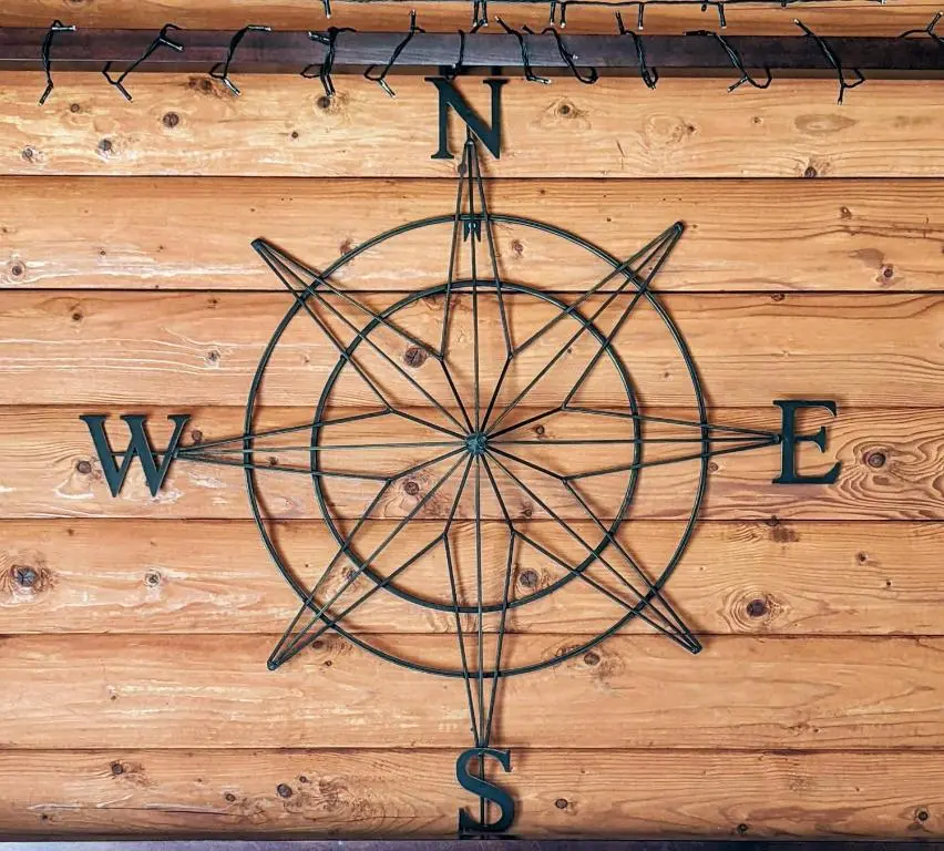 a metal sign on a wooden wall at Kaoglen-Stags Suite-Hot tub-Cairngorms- Dog Friendly in Balnald