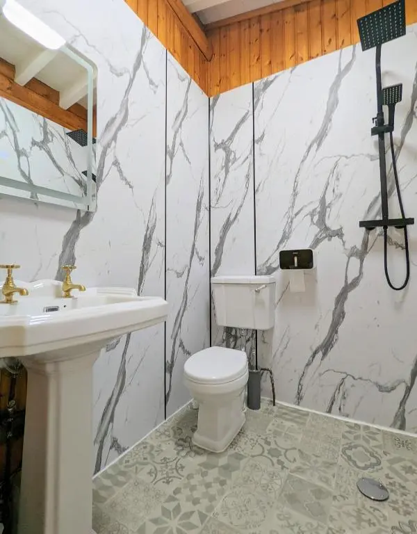 a bathroom with a toilet and a sink at Kaoglen-Blossom-Hot tub-Cairngorms-Pet Friendly in Balnald