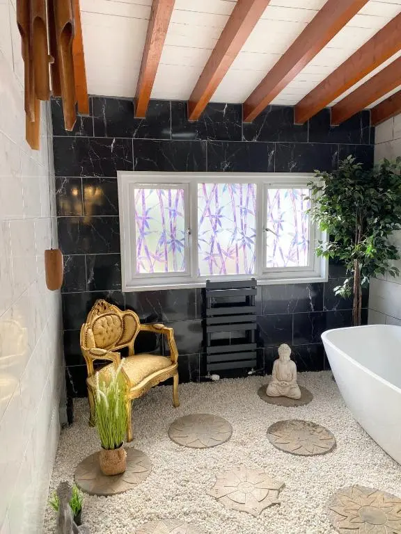a bathroom with a tub and a chair and windows at Kaoglen Zen-Feature Bath-Dunkeld-Route 500 in Balnald