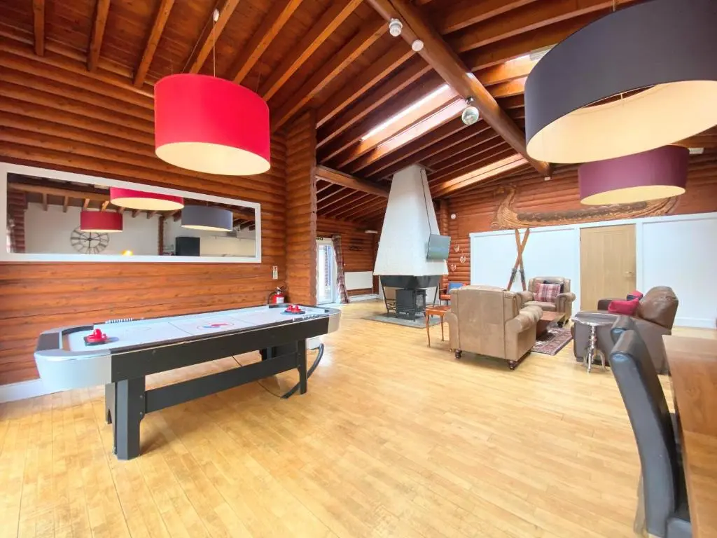 a living room with a ping pong table in it at Kaoglen-GrandSuite-Hot Tub-Pitlochry-Dunkeld-Pet Friendly in Balnald