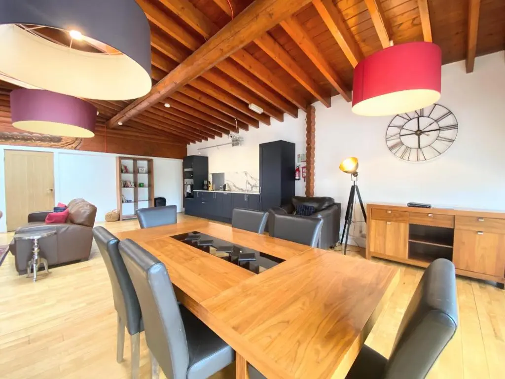 a dining room with a wooden table and chairs at Kaoglen-GrandSuite-Hot Tub-Pitlochry-Dunkeld-Pet Friendly in Balnald