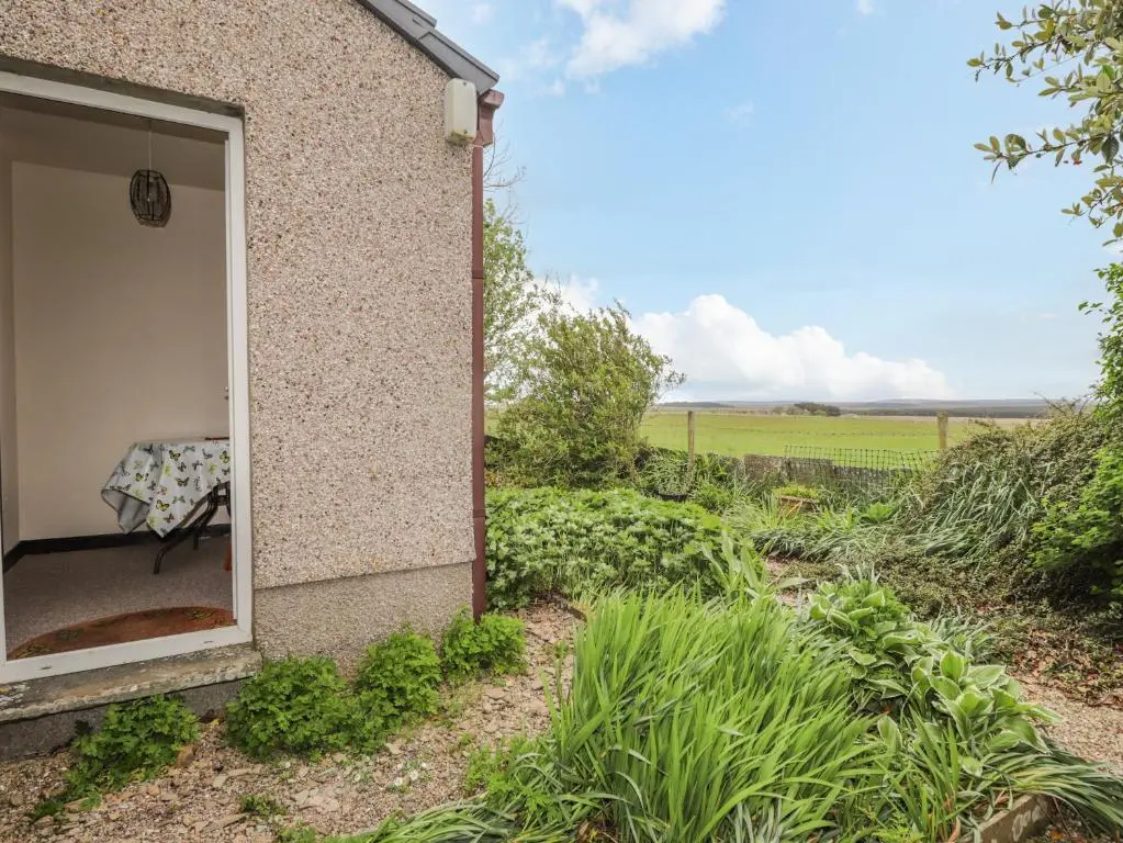 a view from the outside of a house with a window at Star Croft in Wick