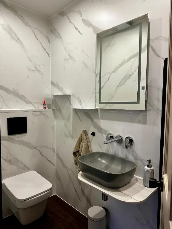 a bathroom with a sink and a toilet at The Pines Guest House in Elgin
