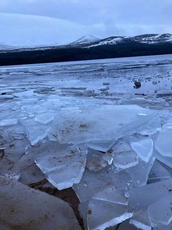 a large ice field with mountains in the background at Uist Cottage in Kingussie