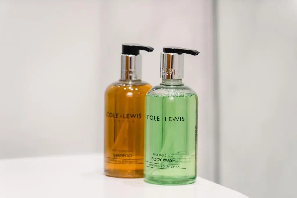 two bottles of liquids sitting next to each other at Stylish Garden Flat Near Loch Ness in Drumnadrochit