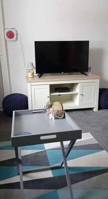 a living room with a tv and a coffee table at Isla Way Stays in Keith