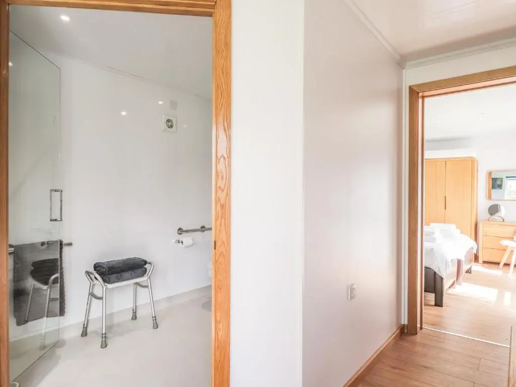 a room with a glass door leading to a bedroom at Moss of Bourach in Aberlour