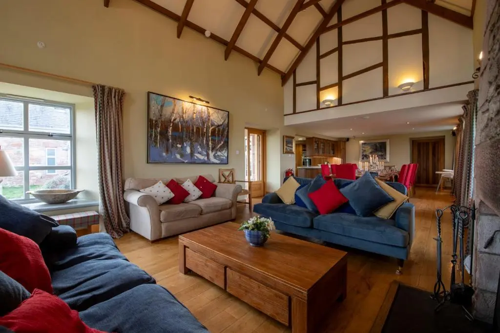 a living room with two couches and a coffee table at Quarryfield in Inverness
