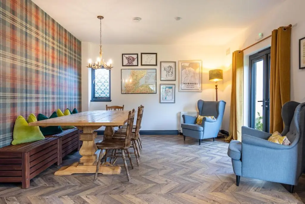 a dining room with a table and chairs at Ness on the Lane in Inverness