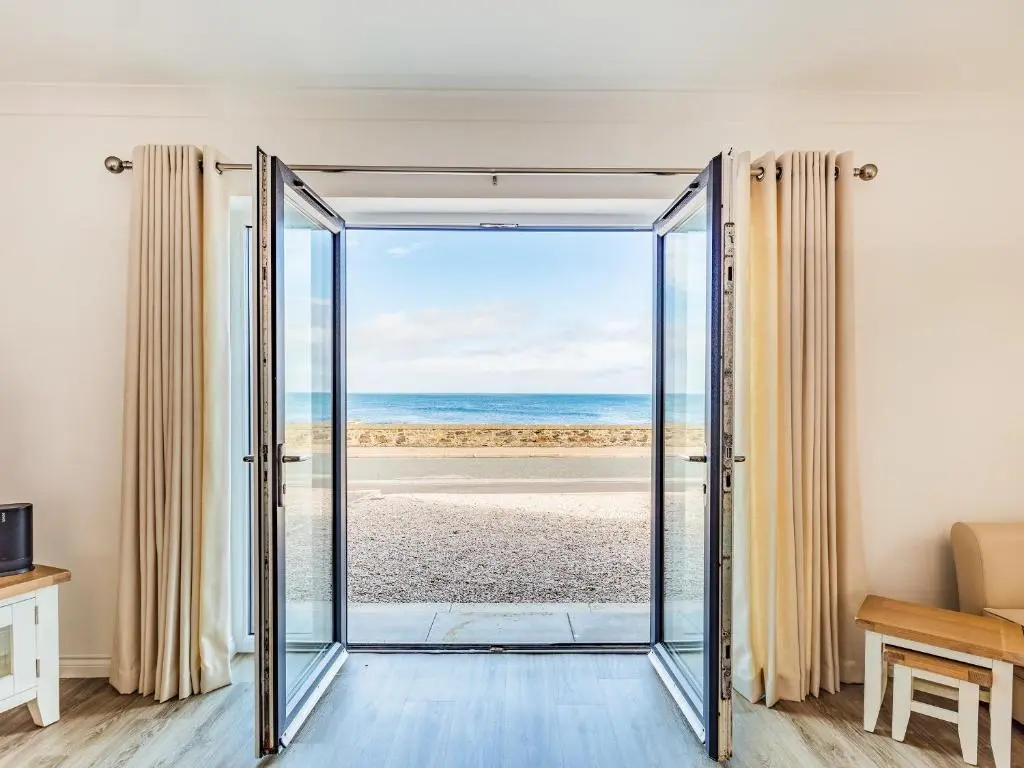 an open door to the beach at Headland View in Banff