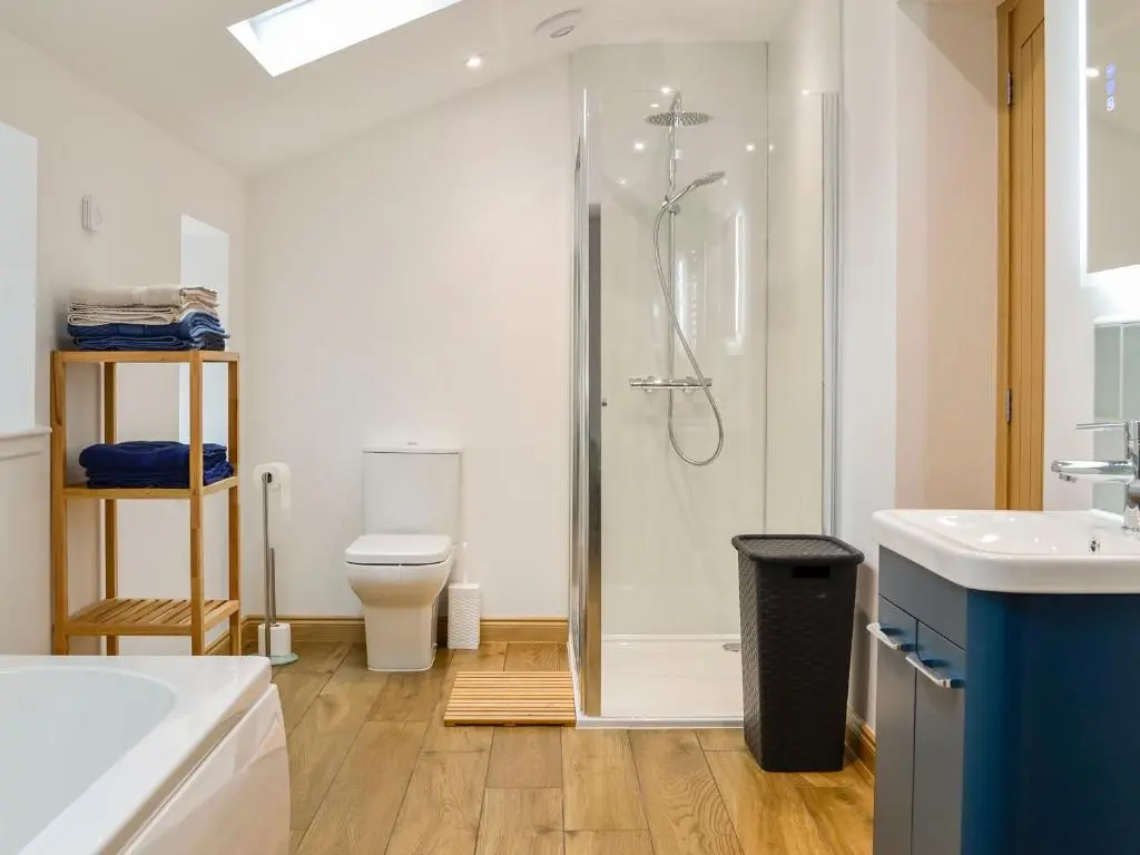 a bathroom with a shower and a toilet at Druids Knowe in Tarfside