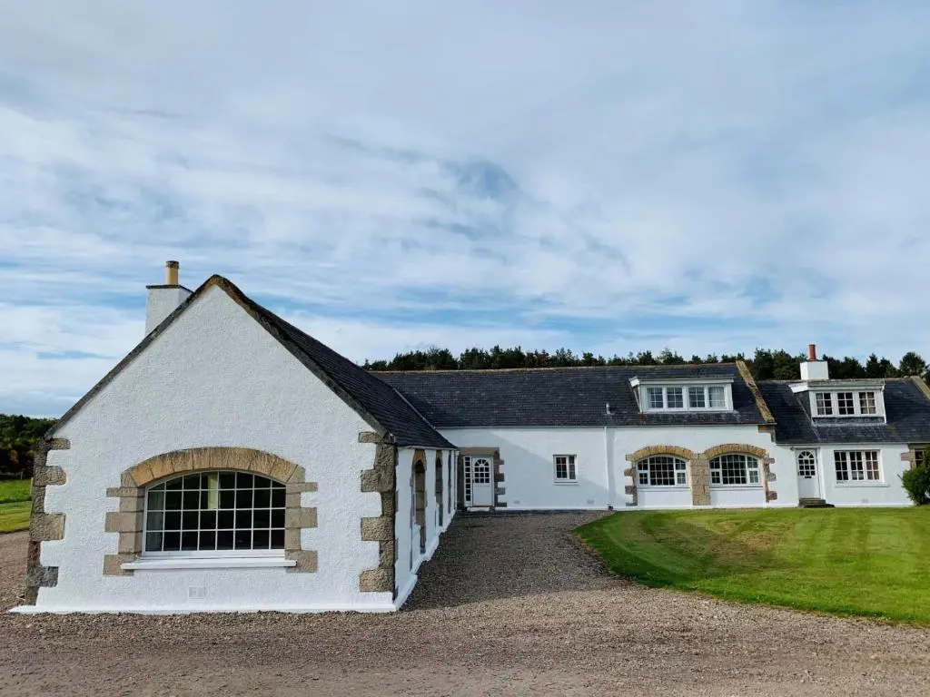 a white house with a black roof at Bruntlands Steading in Fochabers