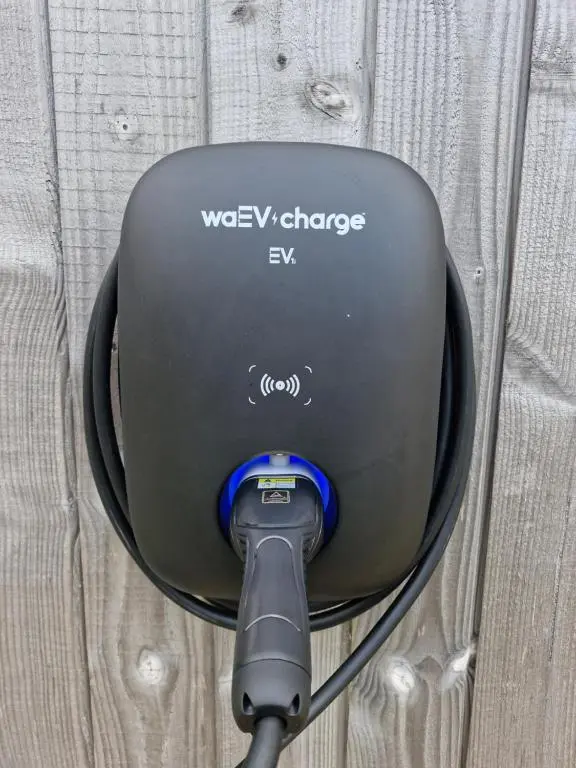 a close up of a wesley changes ev ev chargerccess at Betula Chalet \u2013 coast & country in the Highlands in Nairn