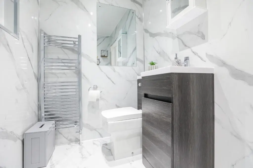 a white bathroom with a toilet and a sink at mySTAYINN Tomnahurich 3 Bedroom House in Inverness