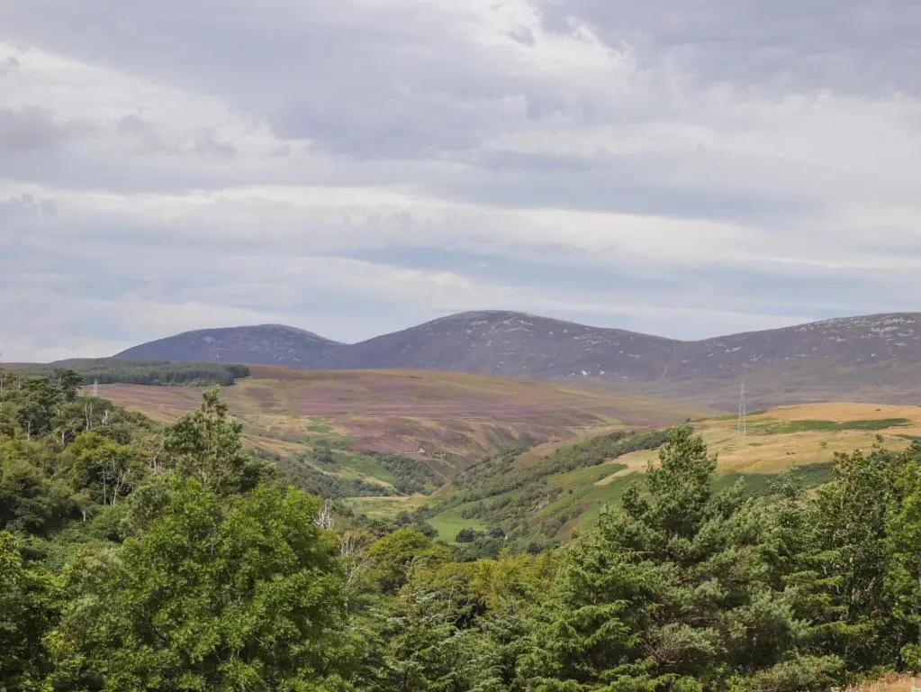 a view of a valley with mountains in the distance at Ceol na Mara in Berriedale