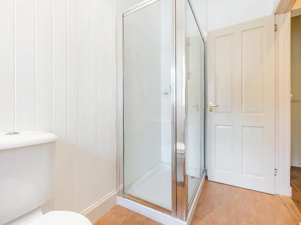 a shower with a glass door in a bathroom at Allt Bronach - Ukc5763 in Laggan