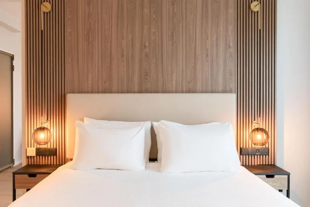 a bedroom with a bed with two white pillows at AC Hotel by Marriott Inverness in Inverness