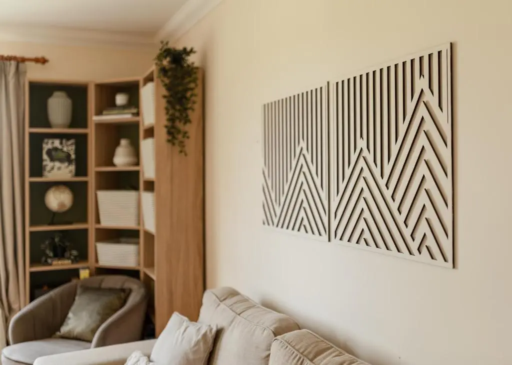 a living room with a couch and a picture on the wall at Balnagowan Cottage in Nethy Bridge