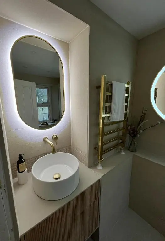 a bathroom with a white sink and a mirror at Ashley House Contemporary 4 Bedroom Stay for 13 in Inverness