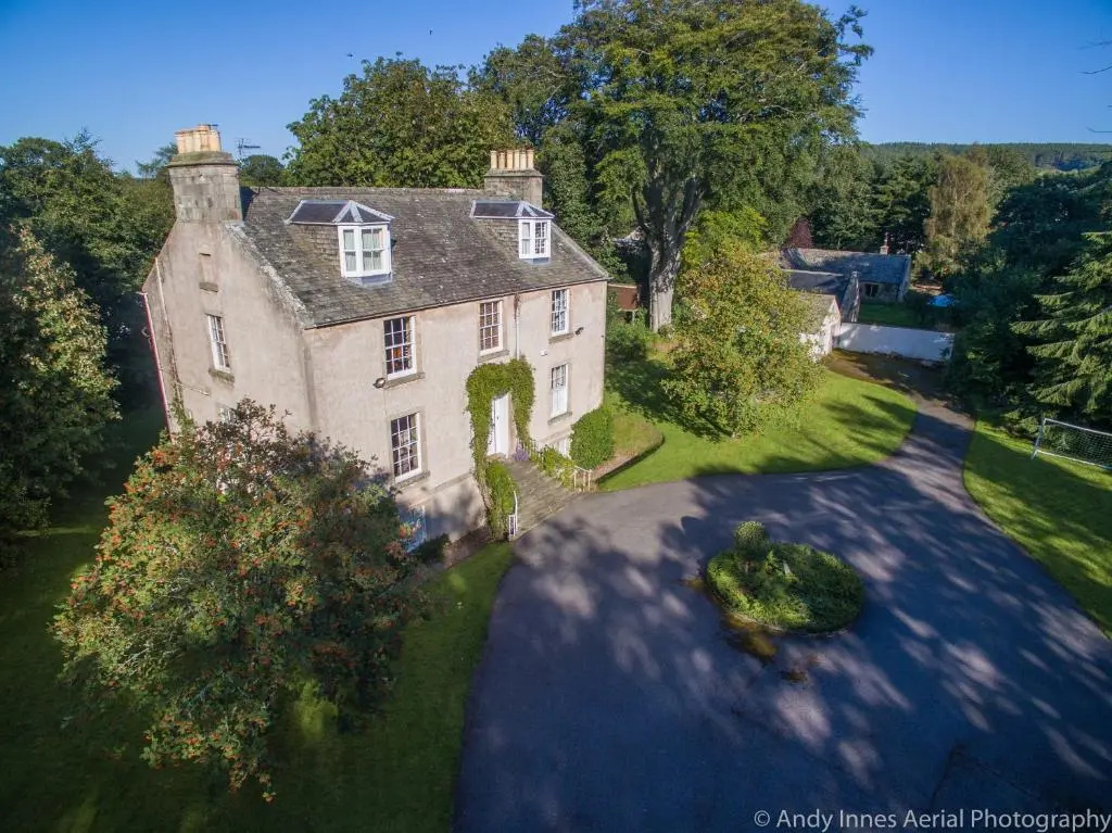 an aerial view of a large house with a driveway at The Old Manse, Fochabers in Fochabers