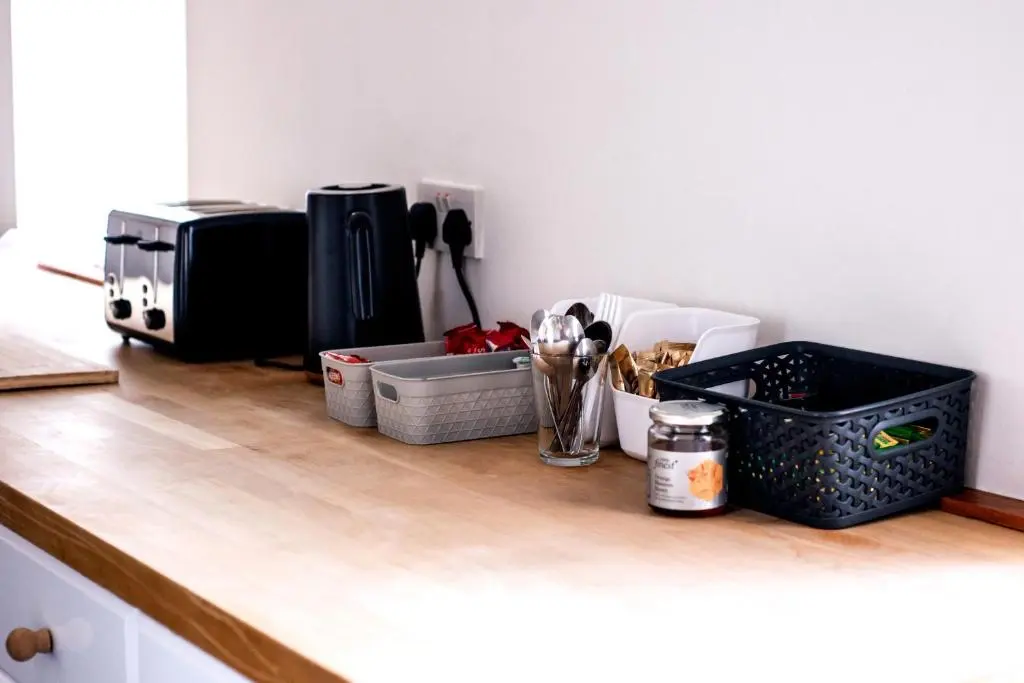 a kitchen counter with utensils and a microwave at Weston House Keith in Keith