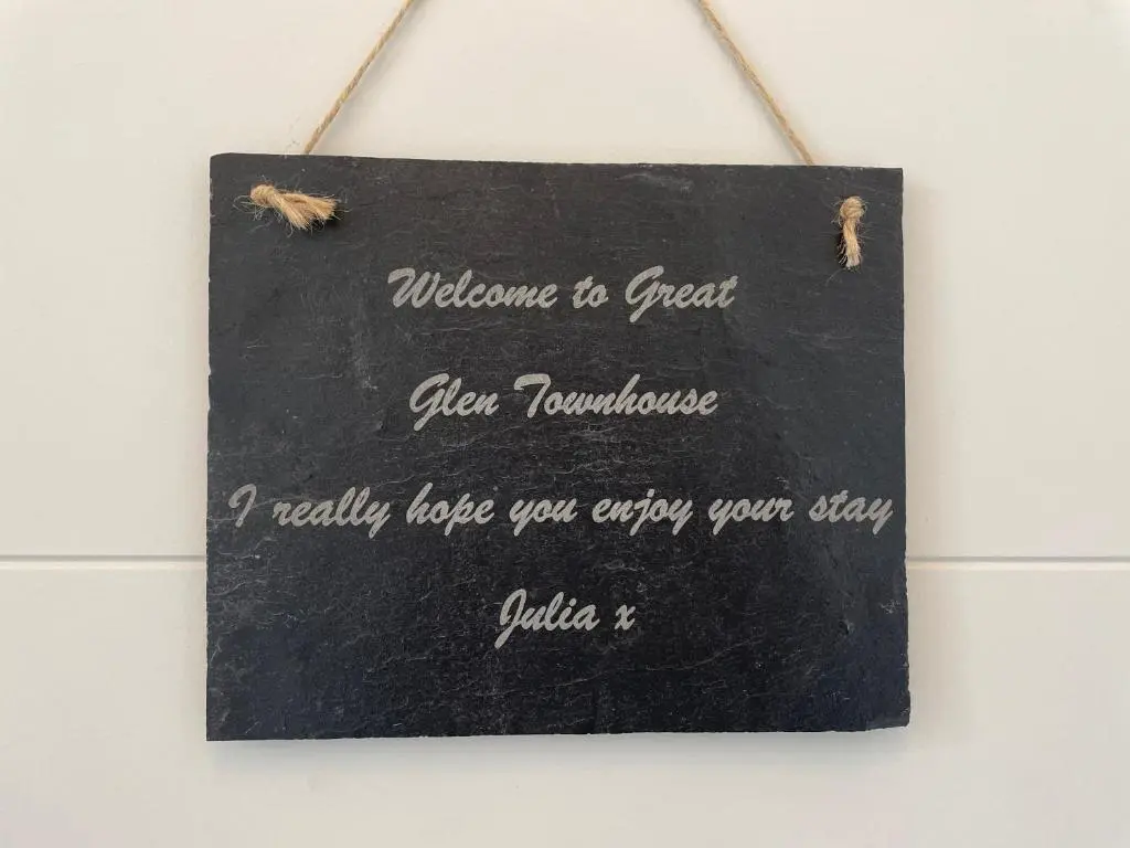 a blackboard with a sign that says welcome to great ever volunteer at Great Glen Townhouse Inverness - Entire 3 Story Townhouse in Inverness