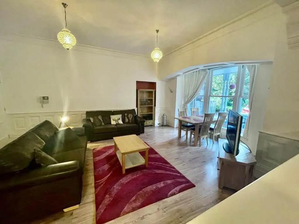 a living room with a couch and a table at Serviced Accommodation Moray - Lesmurdie House No 2 in Elgin