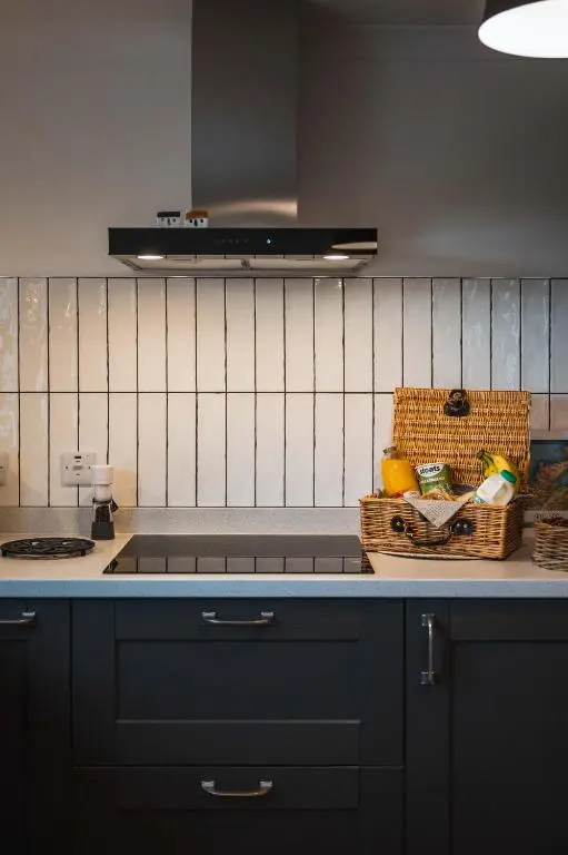 a kitchen with a counter with a basket of fruit at Drumdry in Wick