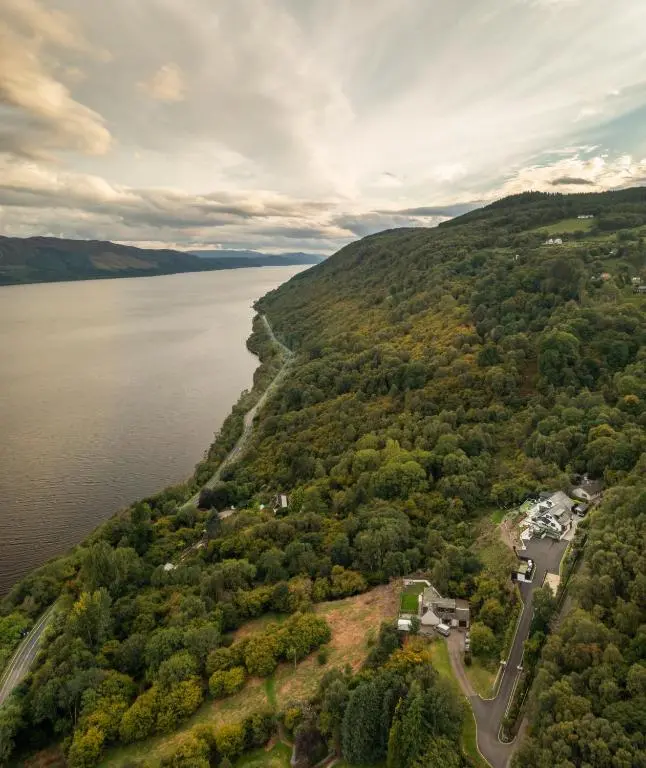 an aerial view of the shore of a lake at Fern View in Inverness