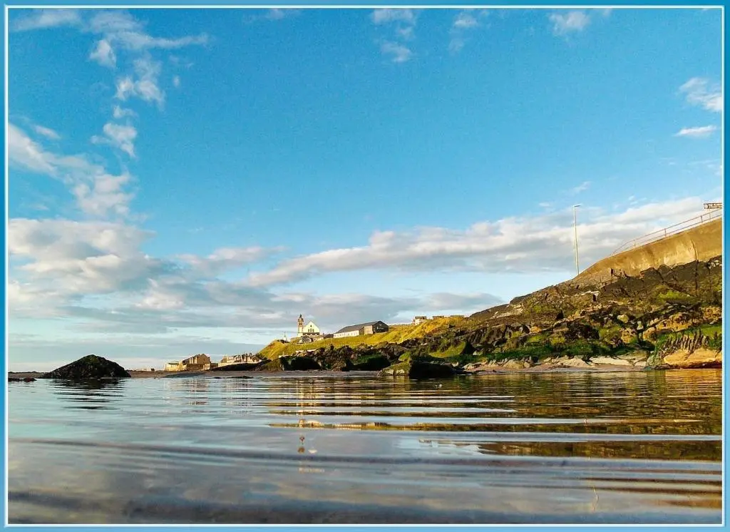 a view of a body of water with a hill at Moray View, Macduff, Aberdeenshire. in Macduff