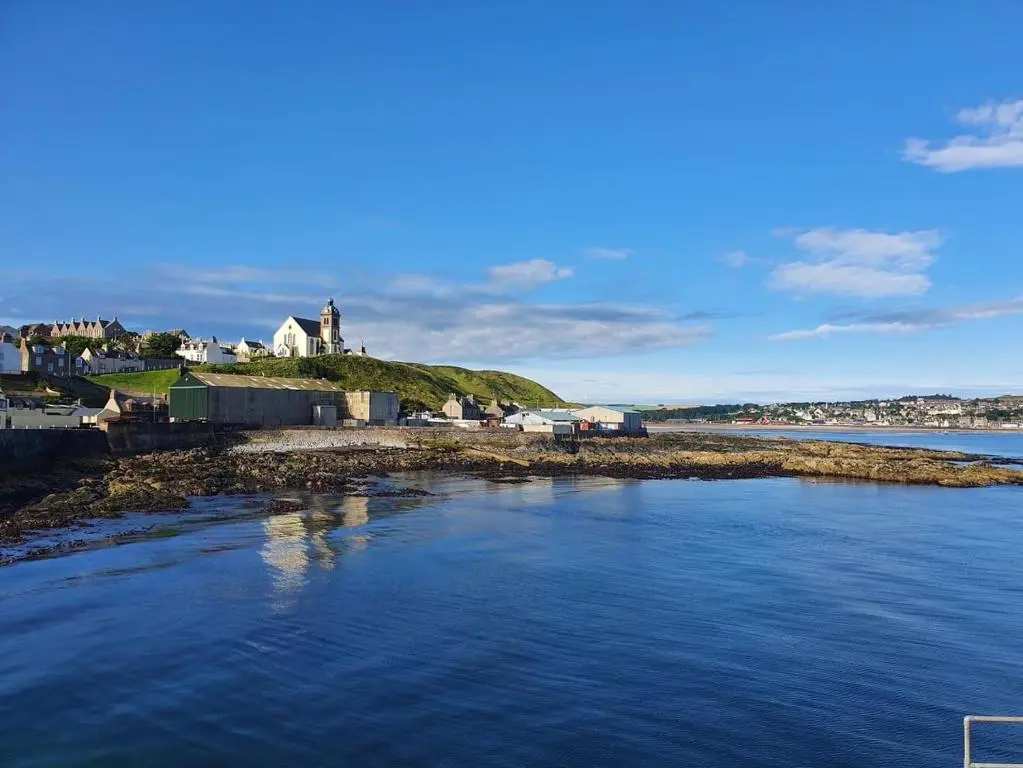 an aerial view of a small island in the water at Moray View, Macduff, Aberdeenshire. in Macduff