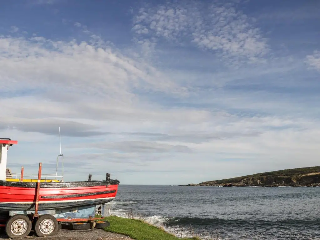 a boat on a trailer next to the water at 2 Seafield Place in Portsoy