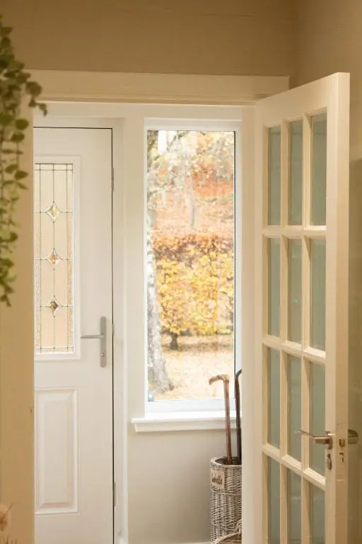 a door leading into a room with a window at Dalnaglar in Nethy Bridge