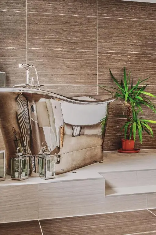 a bathroom with a sink and a bath tub at Loch Ness Mansion in Invermoriston