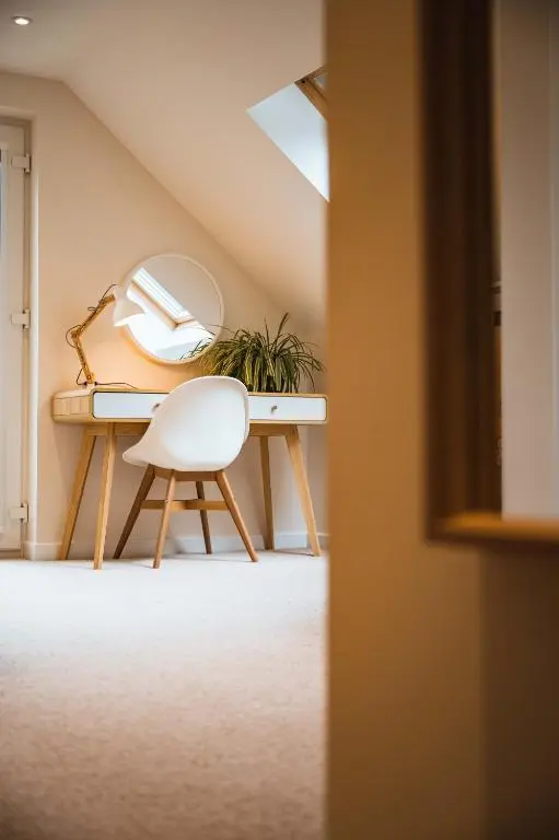 a white chair sitting in front of a desk at Taighsona Bothy, Speyside - amazing views! in Archiestown