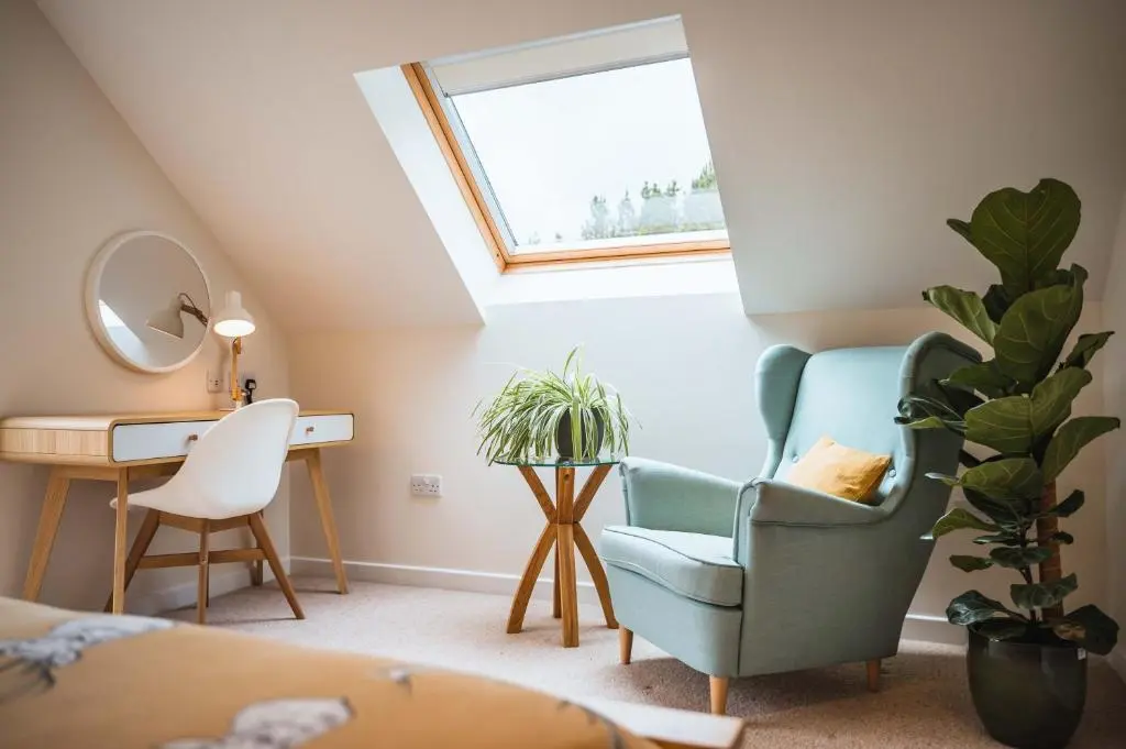 a room with a chair and a desk and a window at Taighsona Bothy, Speyside - amazing views! in Archiestown