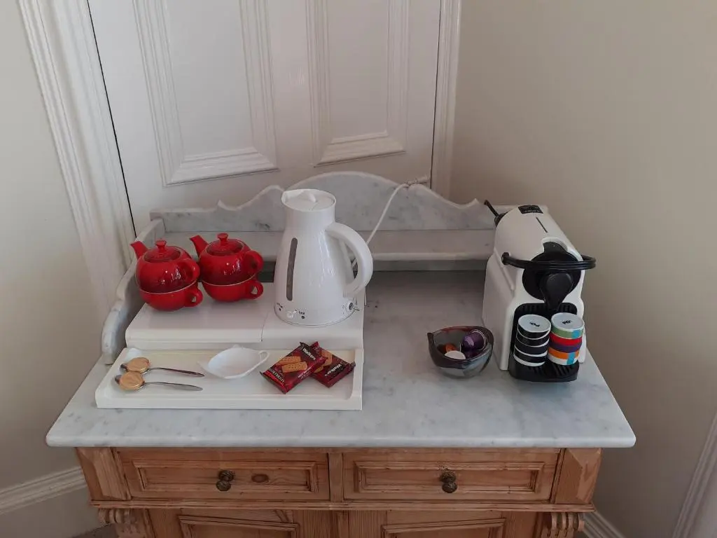 a kitchen counter with a coffee maker and appliances on it at Trafford Bank Guest House in South Kessock