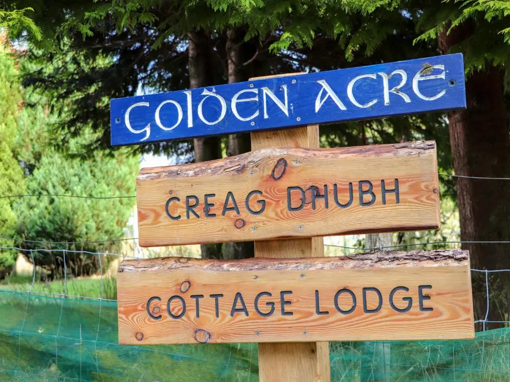 a sign that says golden age and creasy church and coffee lodge at Creag Dhubh Cottage in Newtonmore
