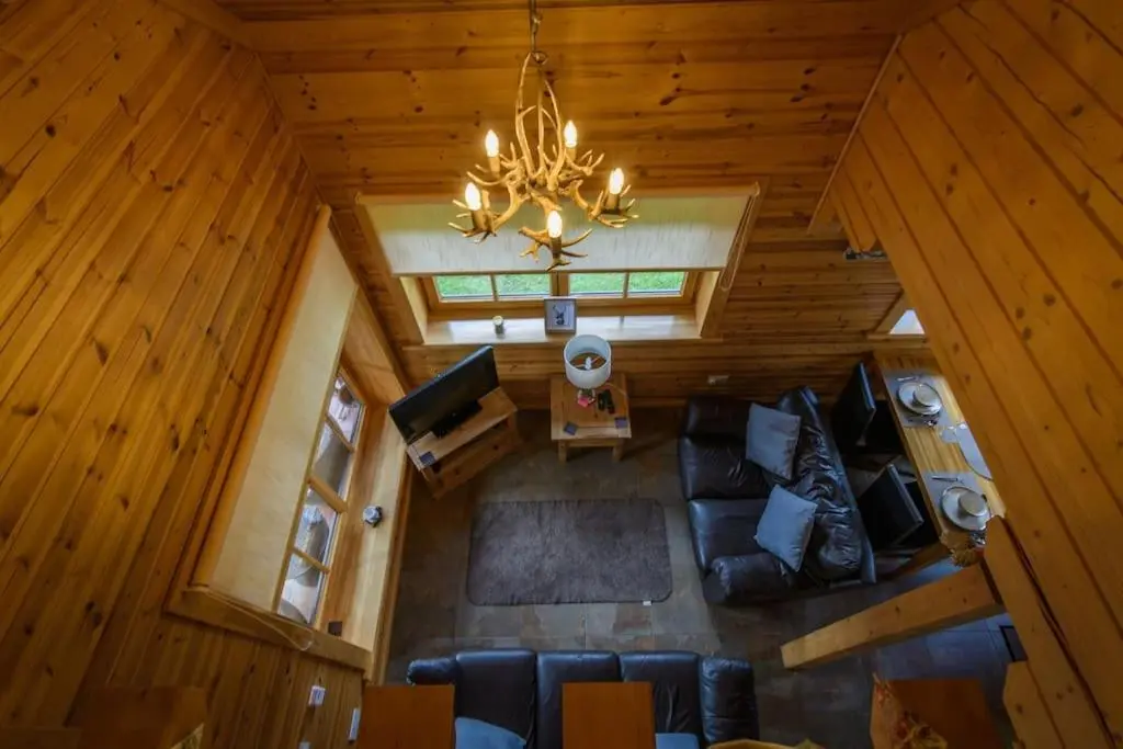 an overhead view of a living room in a cabin at Norwegian Log Cabin The Roe Deer -sauna & hot tub in Keith