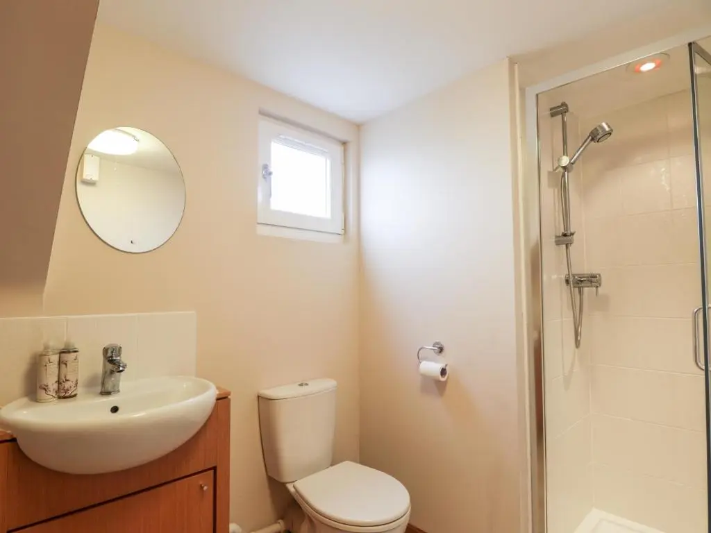 a bathroom with a toilet and a sink and a shower at Learig in Buckie