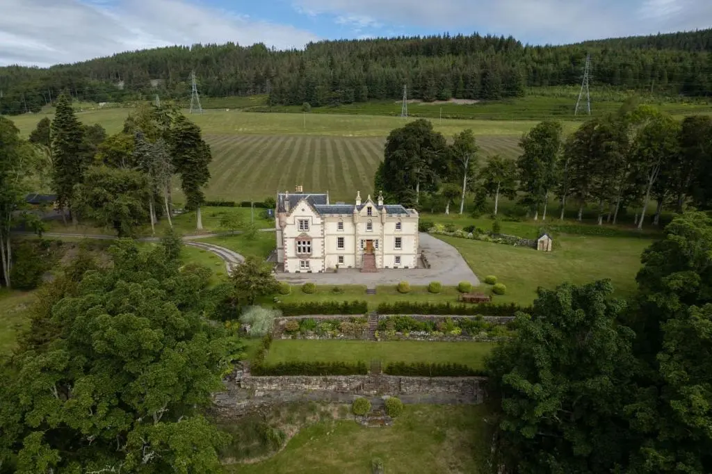 an aerial view of a house in a field at Assynt House - Exclusive Use Holiday House in Dingwall