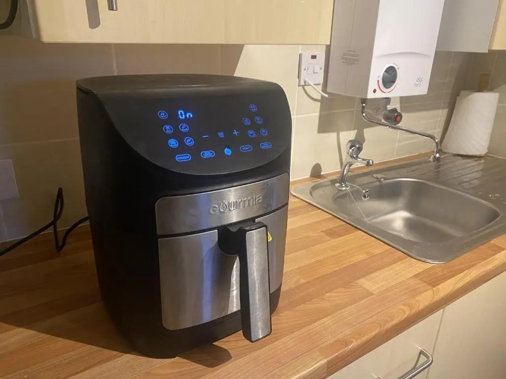 a coffee maker sitting on a counter next to a sink at Ben View Aberlour Luxury Barn Conversion in Aberlour
