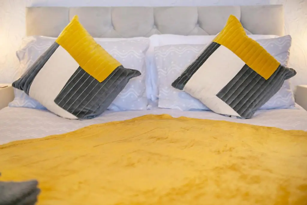 two pillows sitting on top of a bed at Constancevilla B9 - Grampian Lettings Ltd in Aberdeen