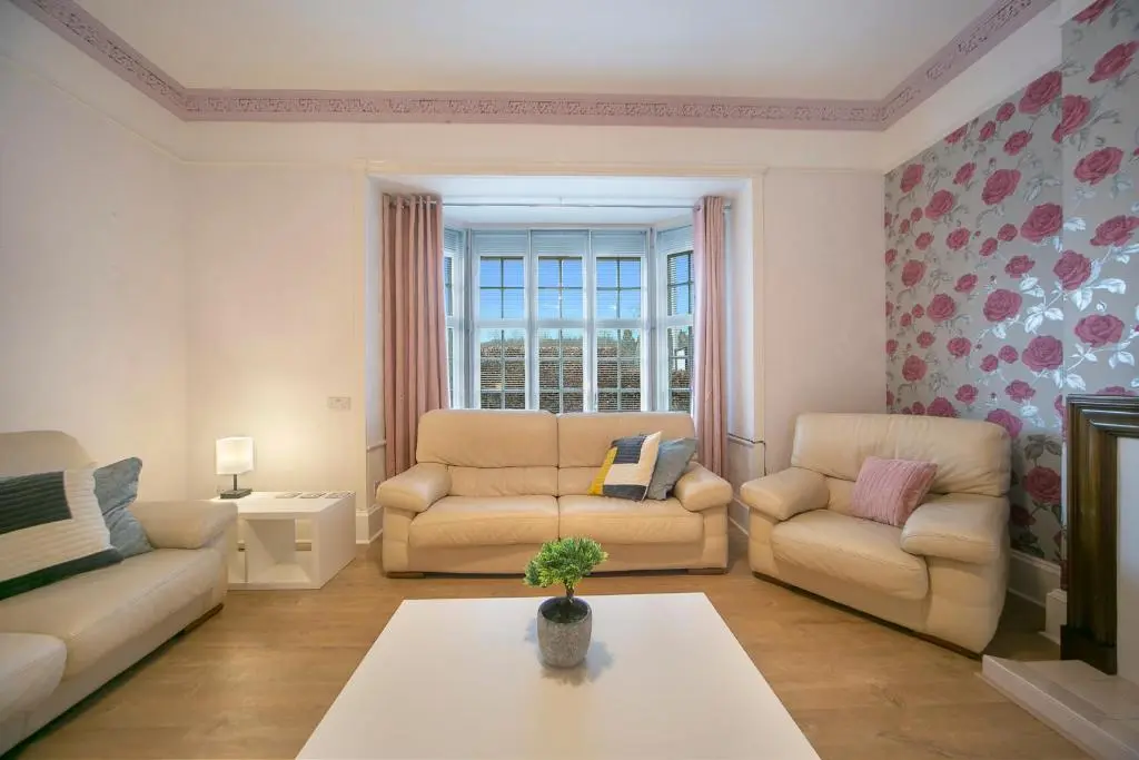 a living room with two couches and a table at Constancevilla B9 - Grampian Lettings Ltd in Aberdeen