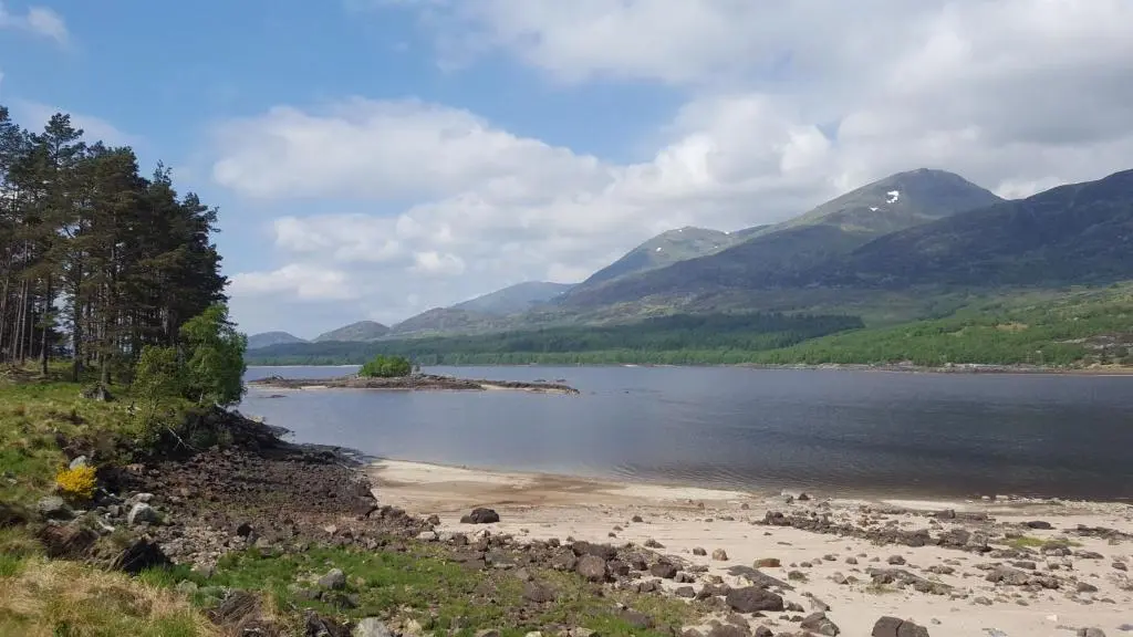 a view of a body of water with mountains at Baltinna West - by Where Stags Roar in Newtonmore