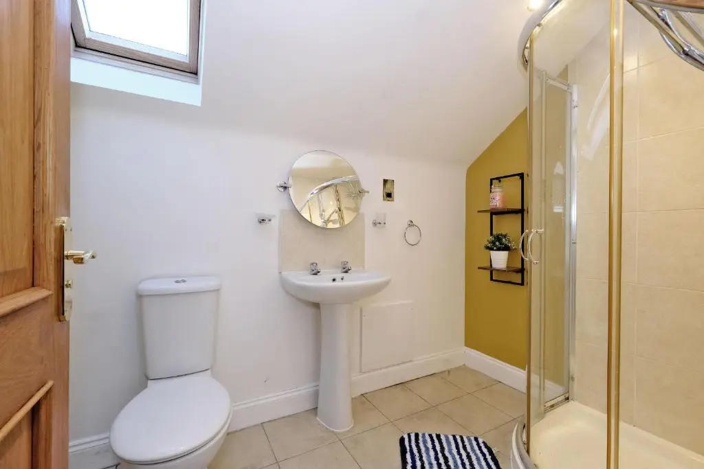 a bathroom with a sink and a toilet and a shower at Rosebrae in Insch
