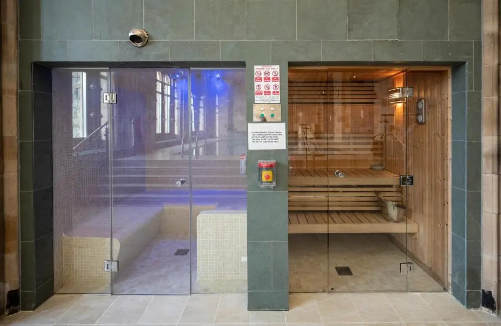 a glass door to a bathroom in a building at Cloister View in Fort Augustus