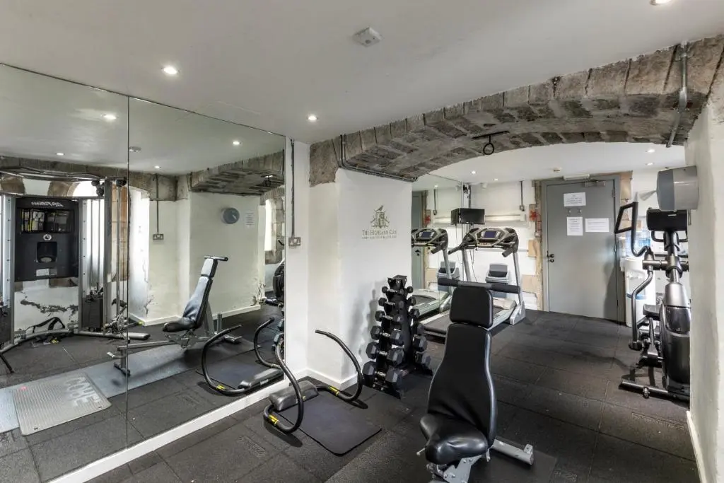 a gym with treadmills and cardio equipment in a building at Cloister View in Fort Augustus